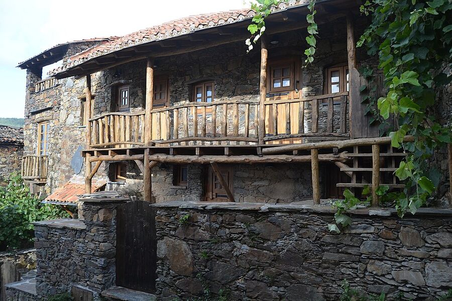 Stone country house with a wide wooden veranda, Alentejo