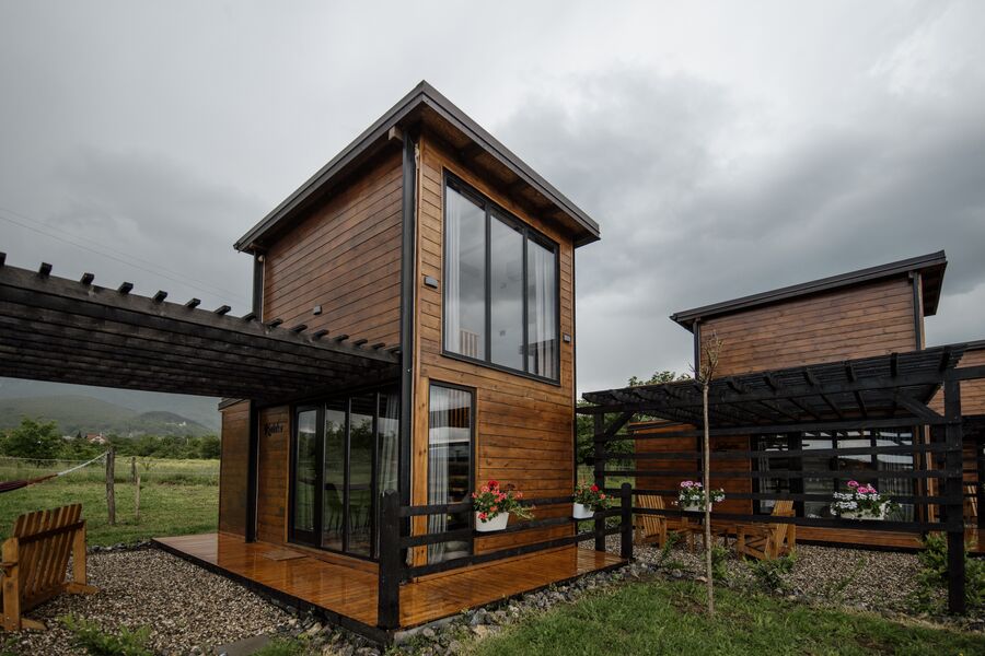Modern timber and glass eco lodge under the Sintra canopy